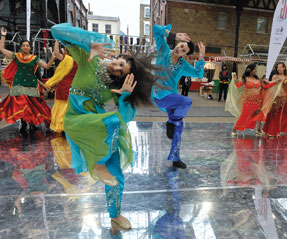 BIG DANCE. Dancers from the Sapnay School of Dance perform a
Bollywood number at Spitalfields Market in London to showcase Big Dance, the world’s largestdance initiative, planned for summer 2010.