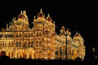 Mysore Palace illuminated at night.