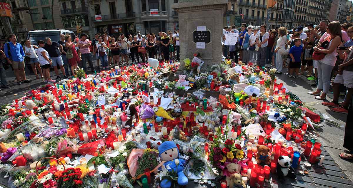 Toys, flowers and candles are placed on the avenue to mourn for victims in the terrorist attacks in the Las Ramblas area of Barcelona, Spain, Aug. 19, 2017.