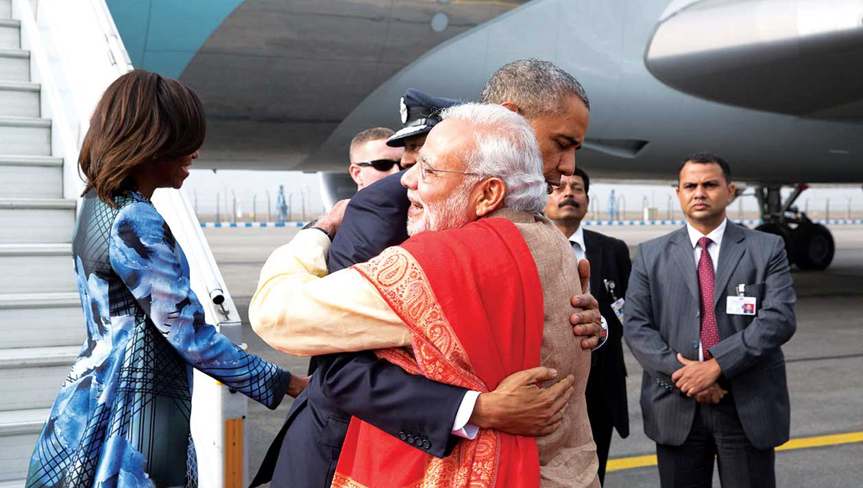 President Obama greets Prime Minister Narendra Modi of India as he and First Lady Michelle Obama arrive at Air Force Station Palam in New Delhi, India, Jan. 25, 2015.