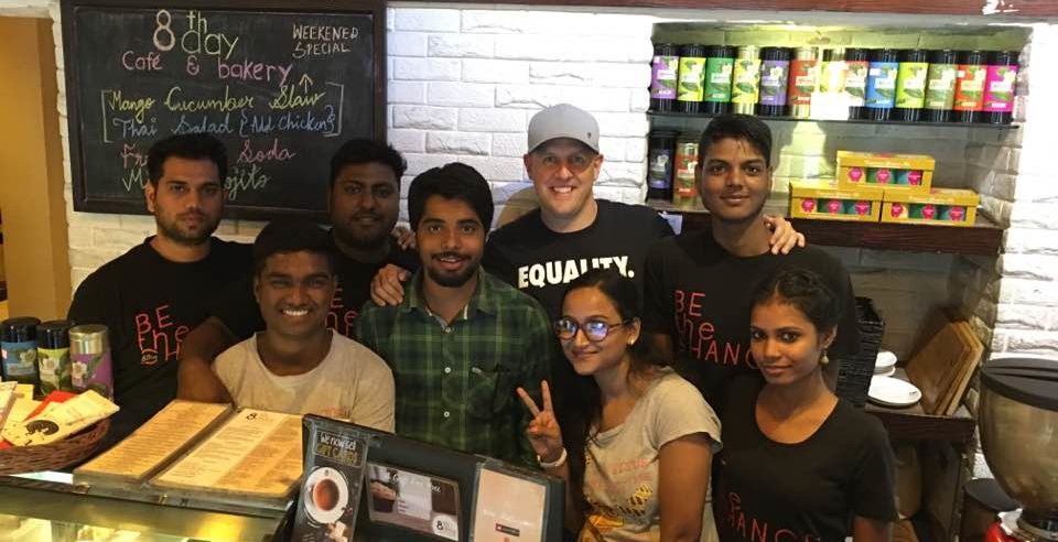Grant Walsh with staff members at 8th Day Cafe and Bakery in Kolkata