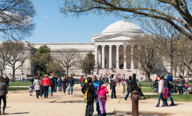 Tourists in front of the National Gallery of Art located on the National Mall in Washington D.C.