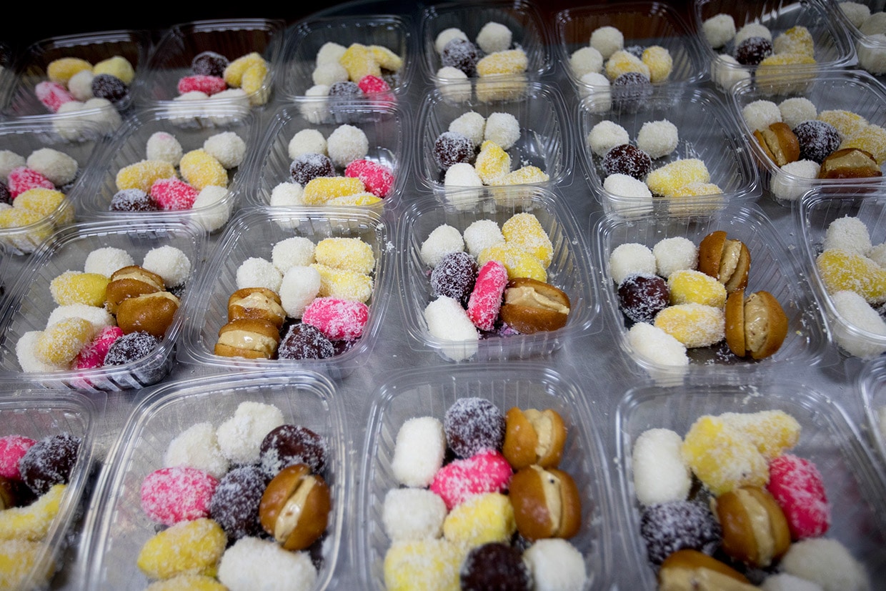 Containers of Bengali mithai, milk and nut-based Indian style sweets in Irving, Texas.
