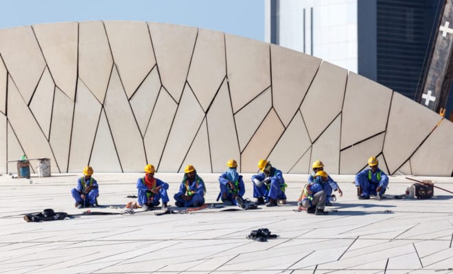 Workers at the construction site of the new Qatar National Museum in Doha, November 18, 2015.