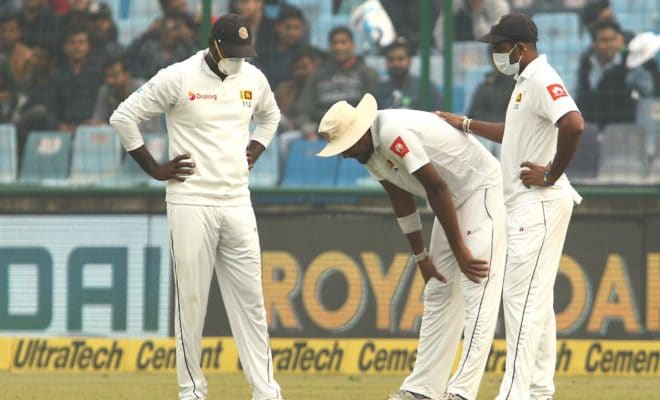 Suranga Lakmal of Sri Lanka falls sick in the field on Day 4 of the third test match between India and Sri Lanka at Feroz Shah Kotla Stadium in New Delhi on Dec 5, 2017.