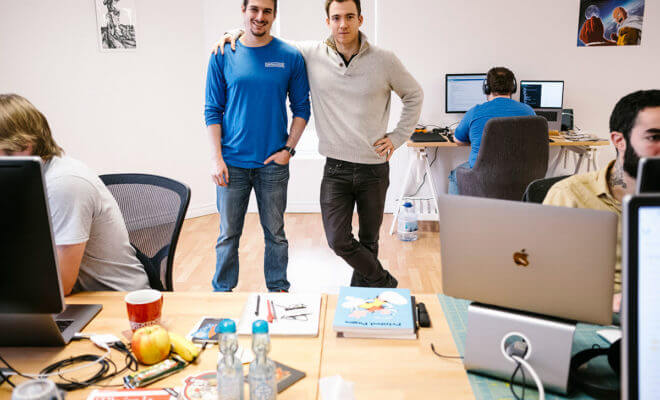 Tim Delisle, left, and Bryan Russett, at the Montreal office of their artificial-intelligence startup Datalogue. The Canadian tech industry is aggressively trying to woo companies like Datalogue, which recently gathered its engineers here instead of its New York office due to immigration hassles.