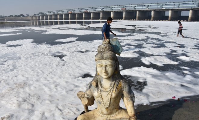 A statue of Lord Shiva on the foamy shoreline of Yamuna river in Mathura on Dec 27, 2017.