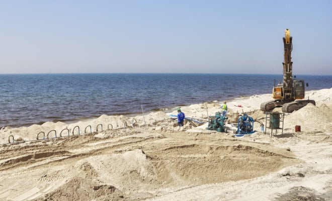 Workers at a beach construction site between Dubai and Sharjah.