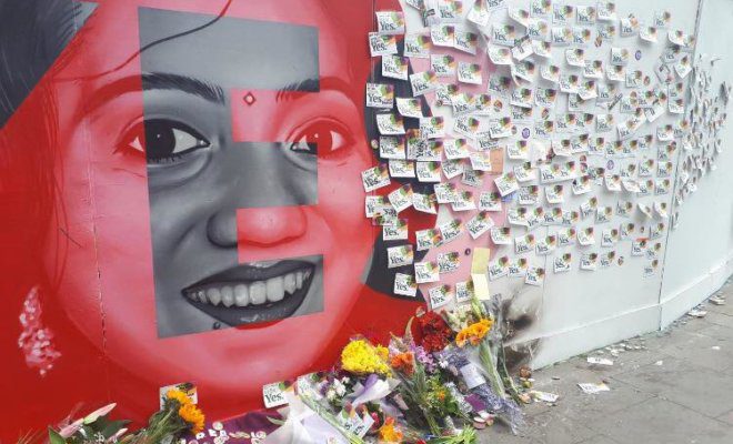 Flowers and notes placed by abortion supporters near Savita Halappanavar's picture in Ireland.