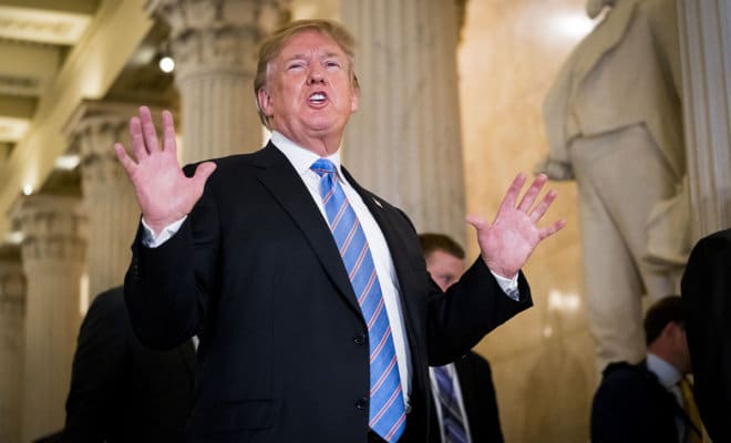 President Donald Trump talks to reporters on Capitol Hill in Washington, June 19, 2018.