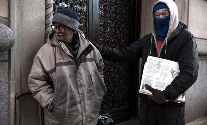 Ram Badan Singh, left,a sidewalk newspaper hawker, with one of his regular customers in New York. While Singh’s sales of The New York Times have dwindled to about 80 a day from nearly 800, he outperforms many brick-and-mortar newsstands.