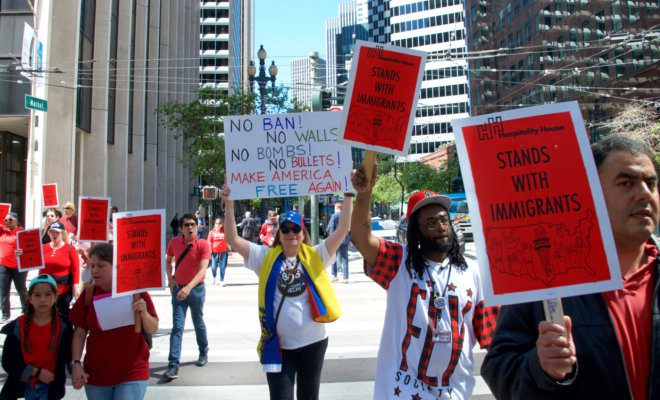 Participants march in San Francisco supporting immigrant rights.