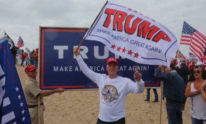 Make America Great Again March. Thousand of Supporters of republican president Donald Trump, march and wave flags, at a MAGA March in Huntington Beach.