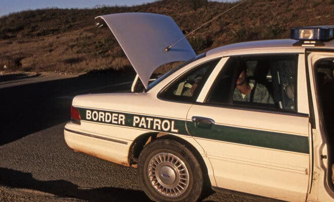 Apprehended illegal alien suspect sitting in back of U.S. Border Patrol Car. (Representational image)