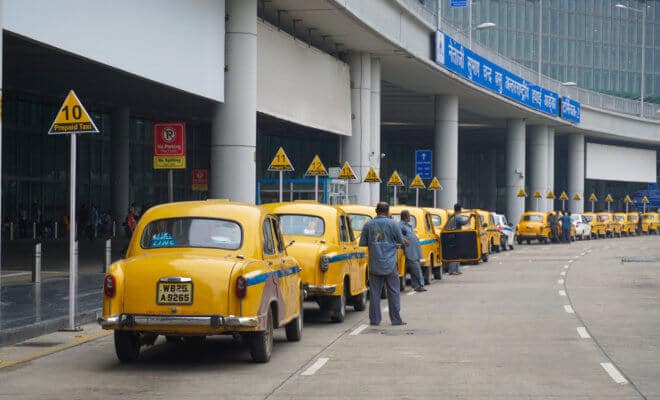 Yellow taxi cars waiting passenger at Kolkata International airport.