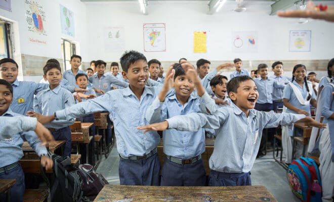 A class of 59 students at a public senior secondary school in Delhi take part in a happiness class that included a mix of yoga, music and ethics.
