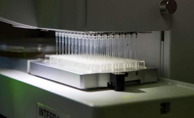A robot transfers bacteria in test tubes to identify the concentration at which the bacteria grows at Bug Works Bengaluru, India, on May 31, 2018.