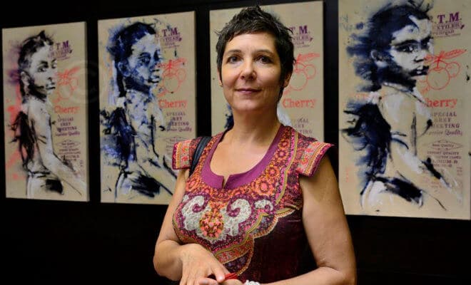 Artist Béatrice de Fays in front of a series of paintings for the contemporary art collection at Park Hyatt Hyderabad.