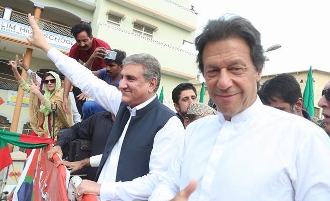 Pakistani Prime Minister Imran Khan (right) with Foreign Minister Shah Mahmood Qureshi