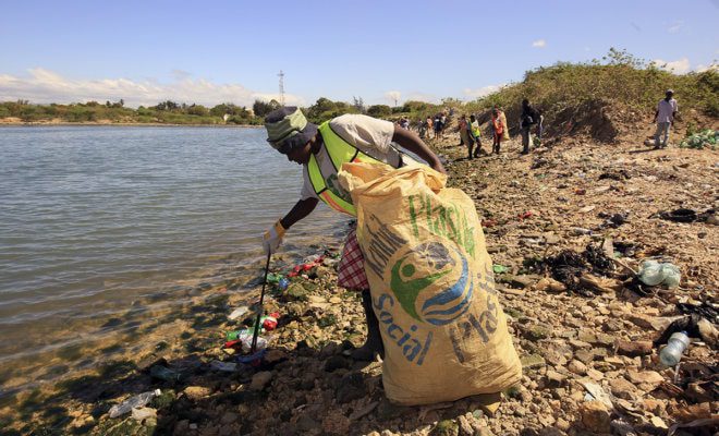 In a photo provided by Plastic Bank, a woman collecting plastic in Haiti, where the Plastic Bank began its work three years ago. Photo: Plastic Bank via The New York Times