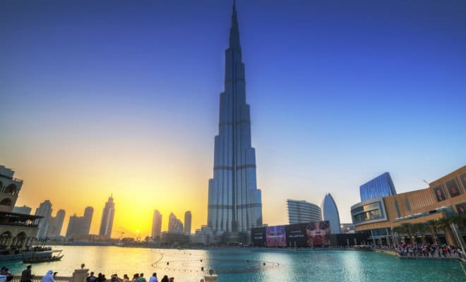 Downtown of Dubai with Burj Khalifa building at sunset.