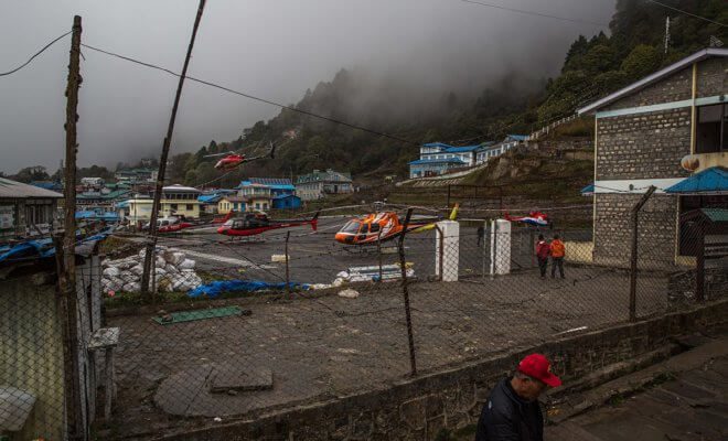 A rescue helicopter lands at an airport in Lukla, Nepal, near Mount Everest, May 3, 2018.