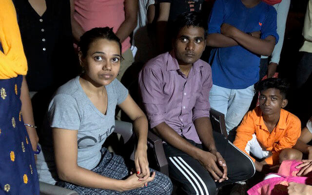 Satya and Angad Pasi, the siblings of Vishal Pasi, one of the victims of Sunday's fatal incident at a sewage treatment plant in New Delhi.