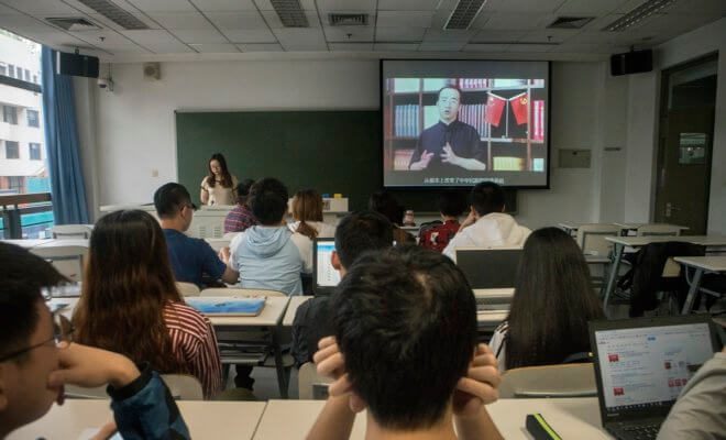 Students watch Feng Wuzhong’s online lecture during a course on Maoist ideology at Tsinghua University in Beijing, May 20, 2018.