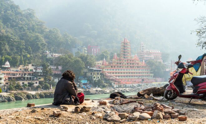 A poor man on the banks of the Ganges river.