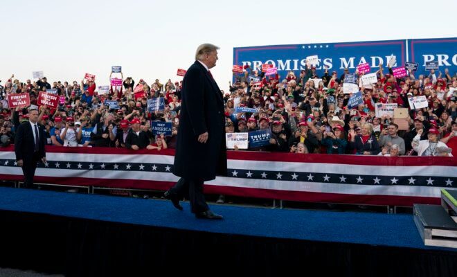 President Donald Trump on stage during a campaign rally in Murphysboro, Ill., Oct. 27, 2018.