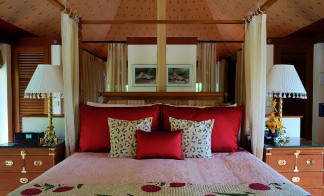 Canopy beds and rooms ensconced with fabric are a big fall trend inspired by luxury tents in India including this one at the Oberoi Sukhvilas in New Chandigarh, India.