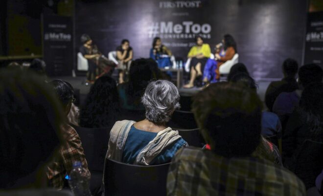 People listen to a discussion with Sandhya and Mahima at a #MeToo event in Mumbai.