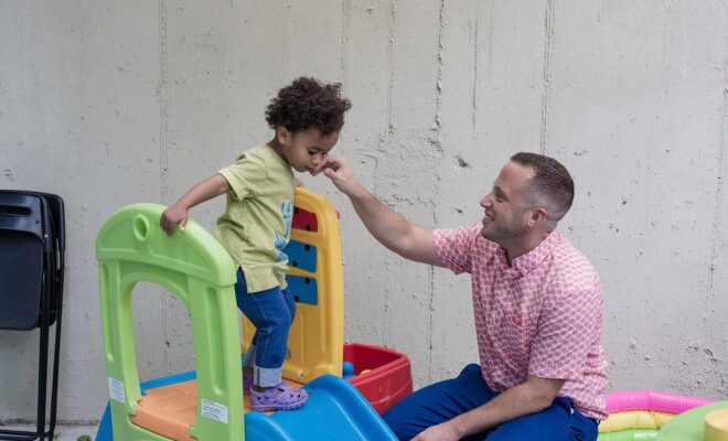Nathan Levitt with his child, Zo, at their home in New York, Sept. 14, 2018. Notwithstanding what is on their children’s birth certificates, a tiny but growing number of parents are raising children as “theybies,” letting them choose a gender when they are ready.