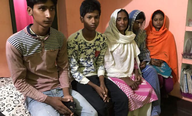 The family of Alimuddin Ansari, who was killed by a mob in India for transporting beef, sacred to the Hindu faith, at the family's home near Ramgarh, India in July 2018. From left: Shahzad Akhtar, Shahbaz Ansari, Mariam Khatoon, Saba Parveen, and Sadia Parveen.