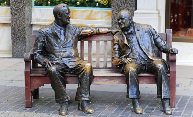 Allies bronze sculpture in London. Franklin D Roosevelt and Sir Winston Churchill at bench New Bond Street in London United Kingdom.