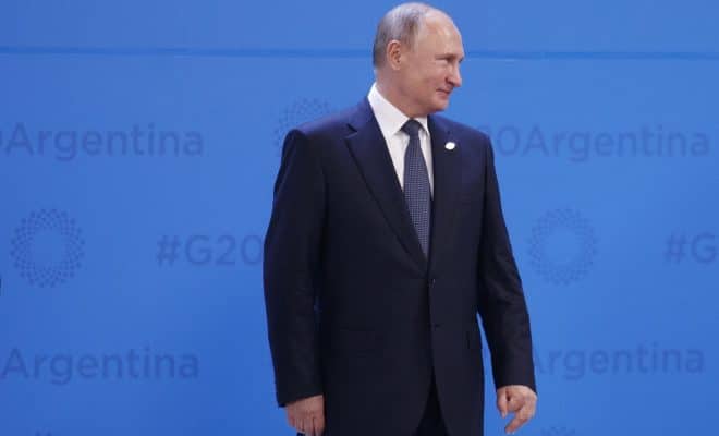President Vladimir Putin of Russia, gathers with other world leaders for a group photo at the G-20 summit, at the InterContinental hotel in Buenos Aires, Argentina, Nov. 30, 2018.